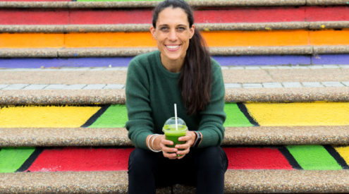 Catherine Morris with a Green Home Compostable Clear PLA cup made from corn. Image: Supplied.